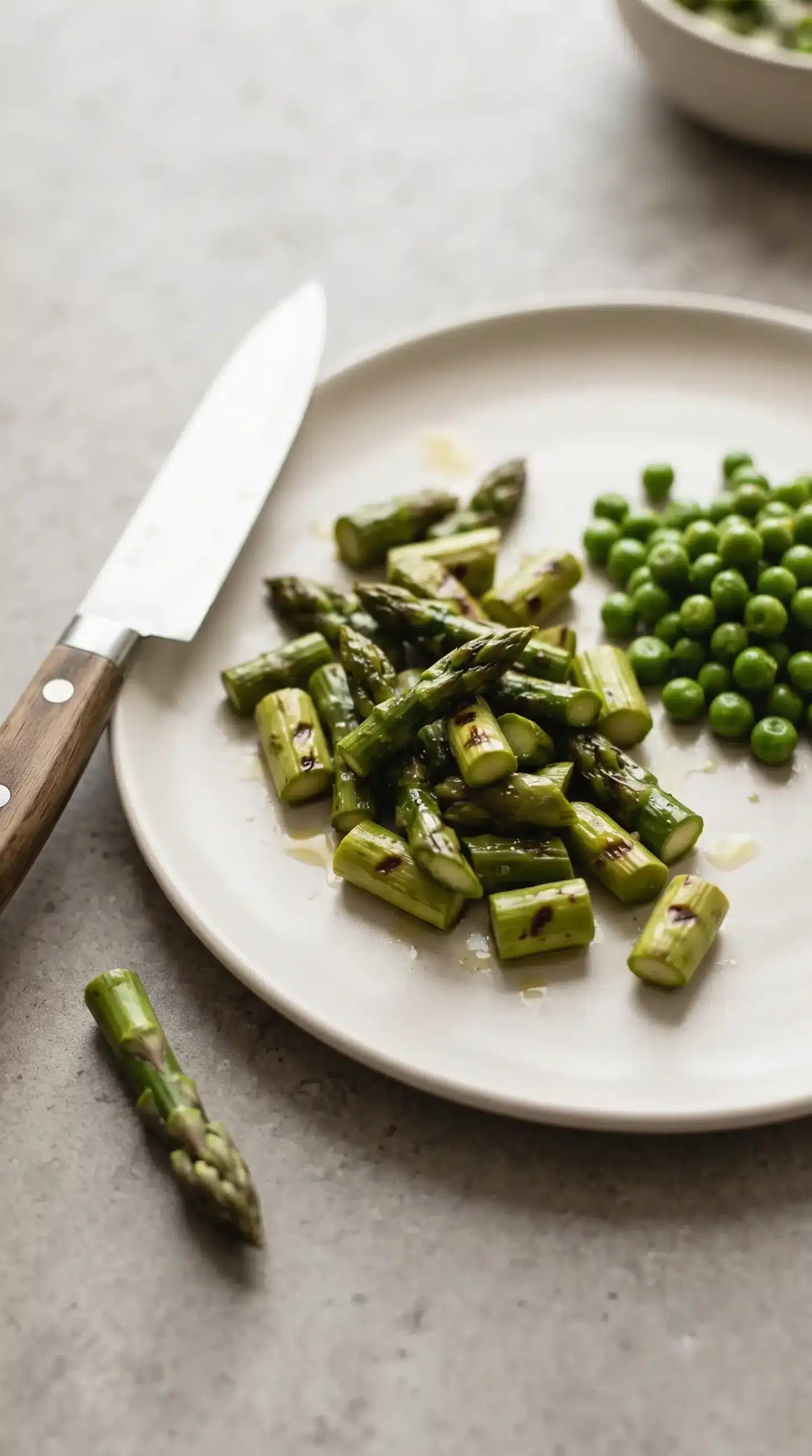 Grilled asparagus pieces prepared with peas for an asparagus quesadilla filling