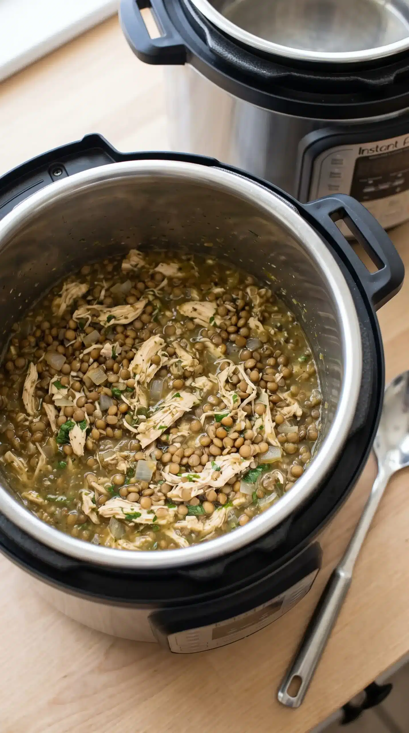 Instant Pot with cooked cilantro lime chicken and lentil mixture
