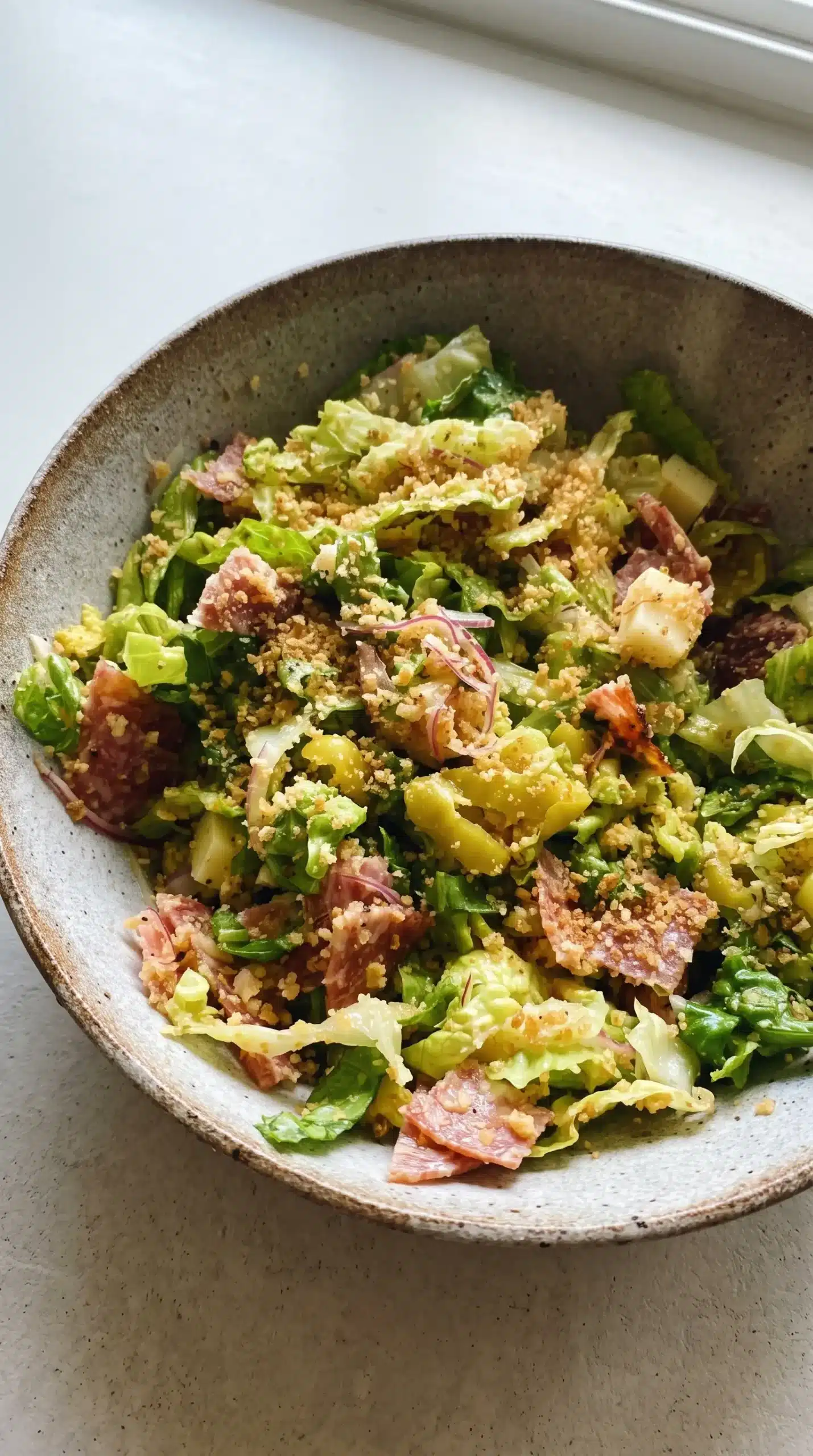 Chopped Italian salad with salami, provolone, Parmesan, pepperoncini, and toasted panko